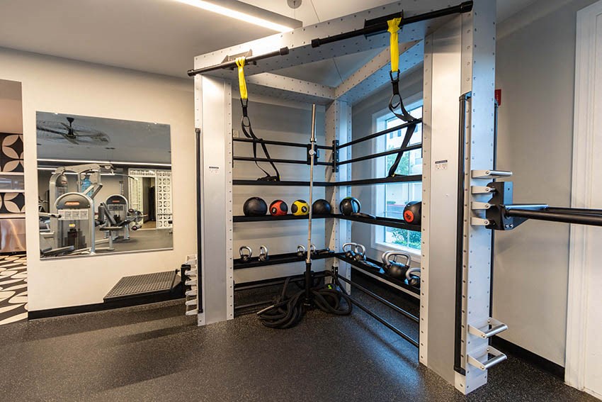 a gym with weights and other equipment in a building