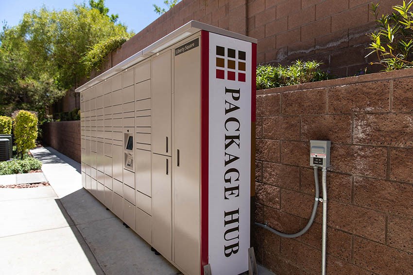 a small electric generator sitting next to a wall