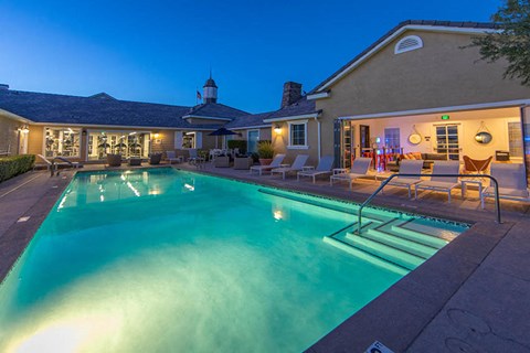 a swimming pool in front of a house