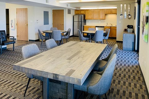 a conference room with a large table and chairs