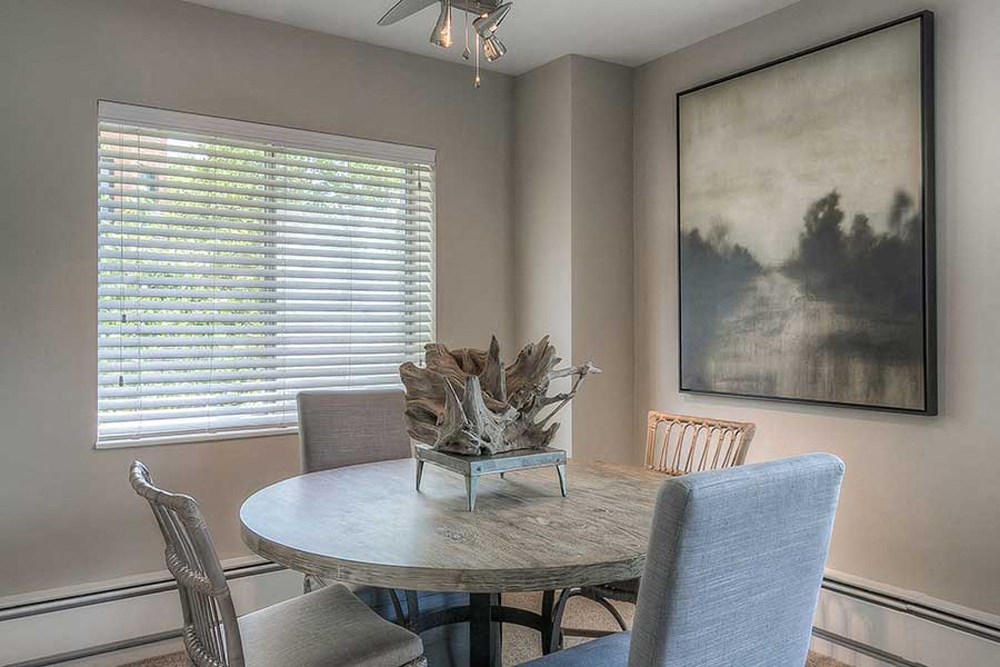 a dining room with a table and chairs