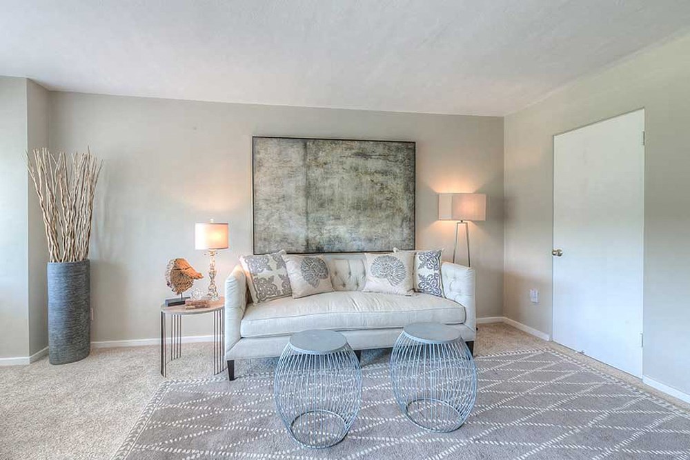 a living room with a couch and a table