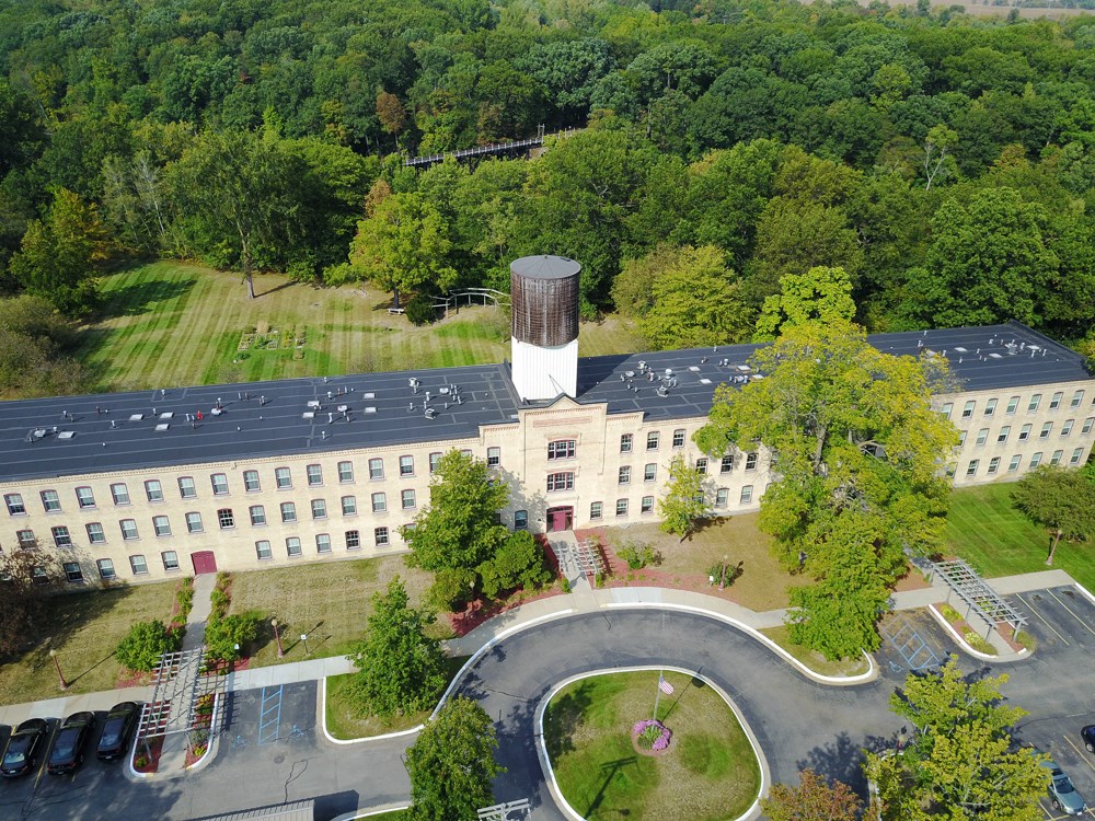 an aerial view of a building with a water tower
