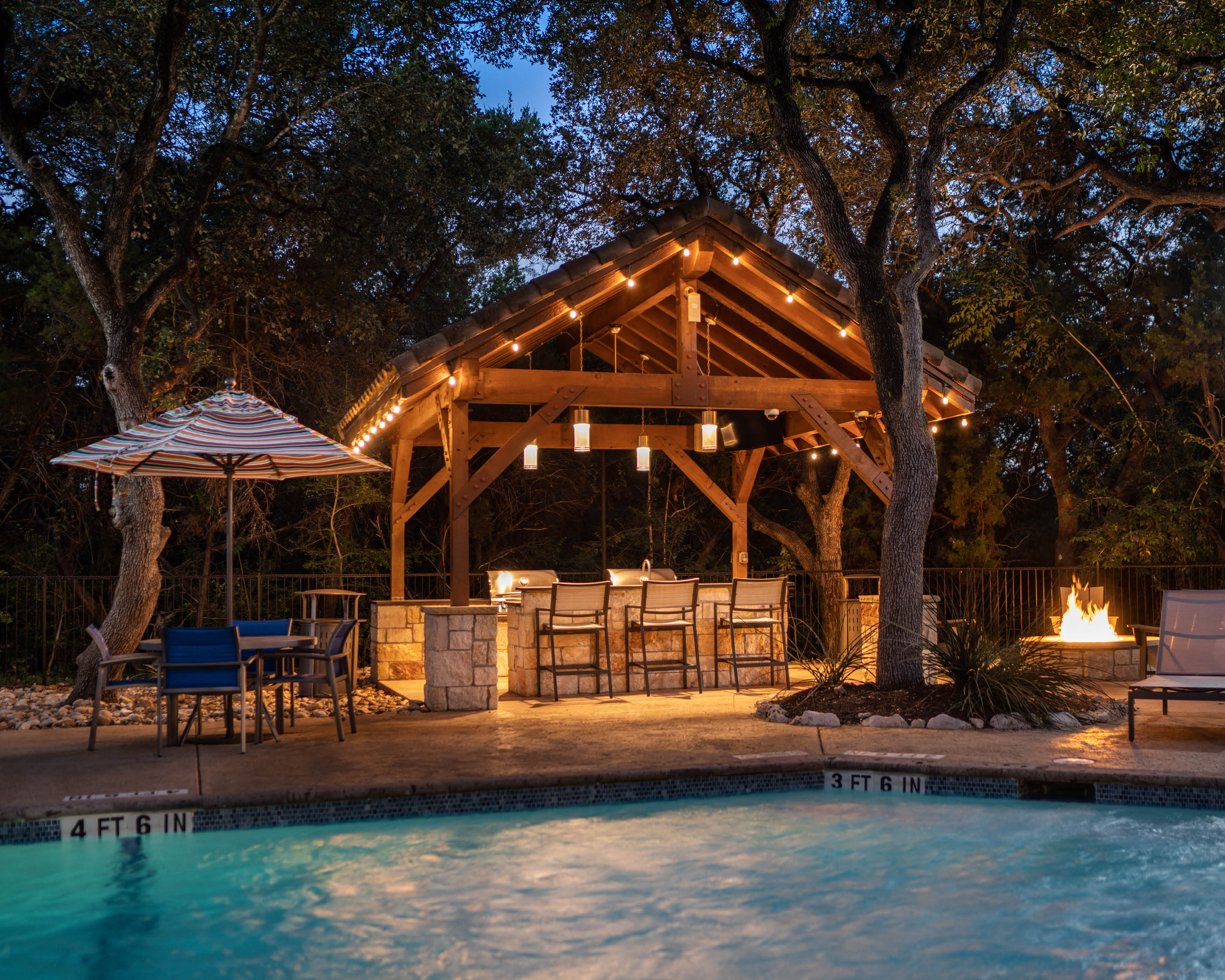 outdoor kitchen at night at Nalle Woods of Westlake, Austin, TX