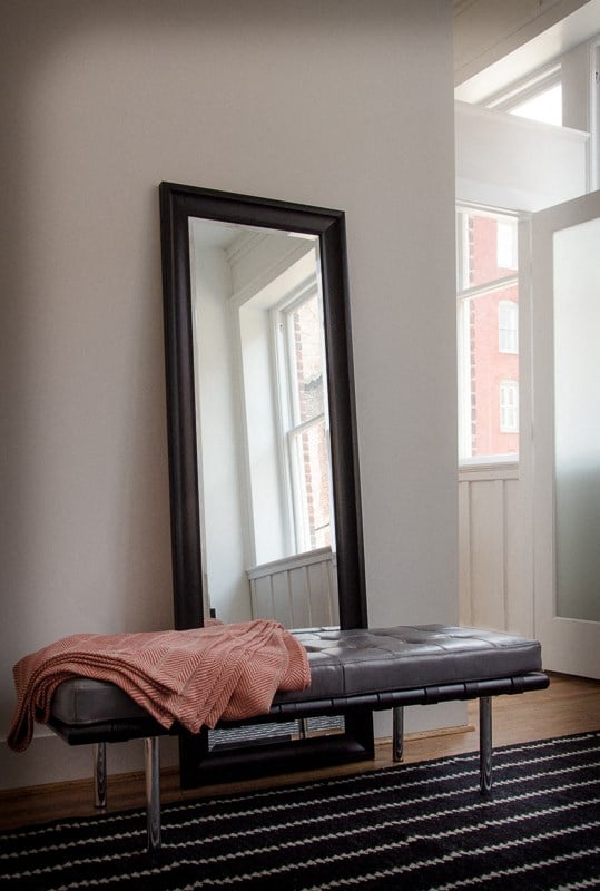 a mirror and a couch in a room