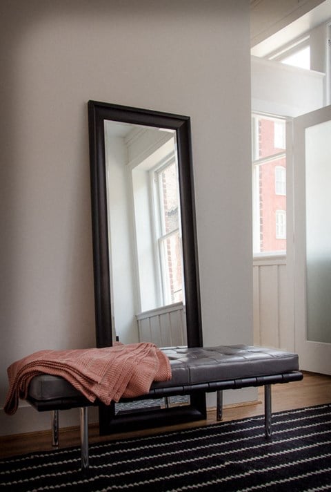 a mirror and a couch in a room