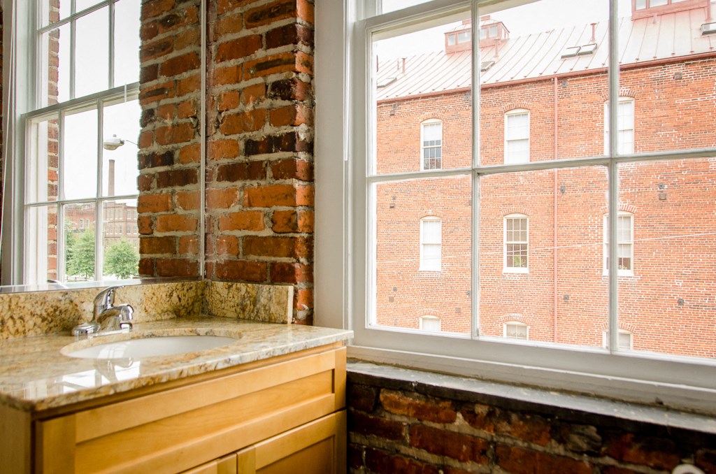 a kitchen with a sink and a window