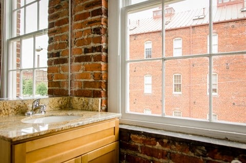 a kitchen with a sink and a window