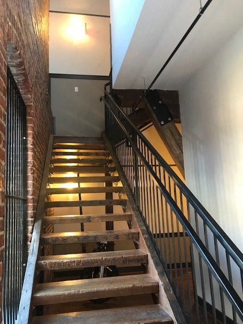 the stairs in a building with a railing and