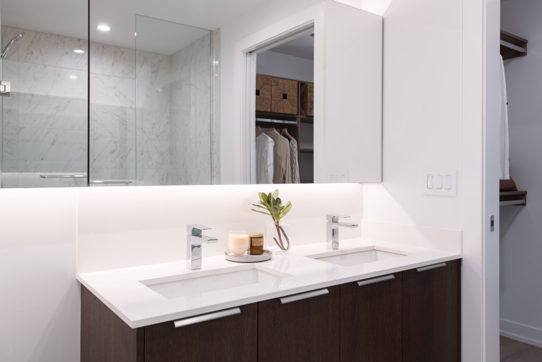 a bathroom with two sinks and a mirror