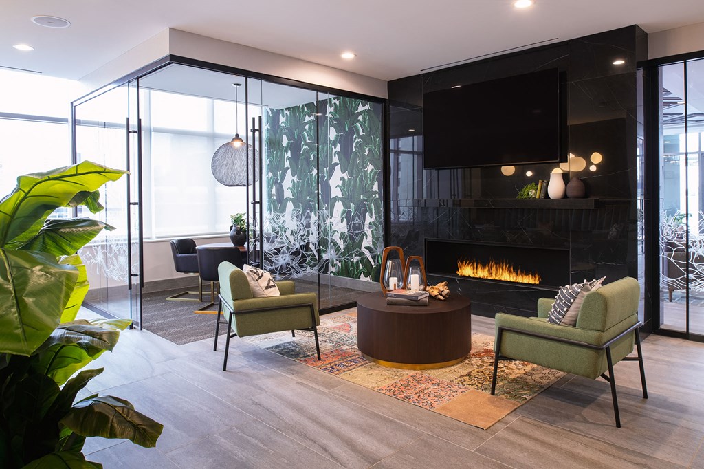 a living room with a fireplace and a television