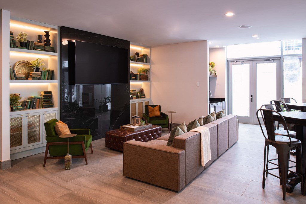 a living room filled with furniture and a tv