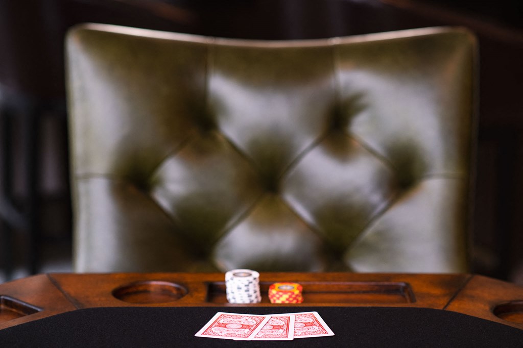 a poker table with cards and dice on it