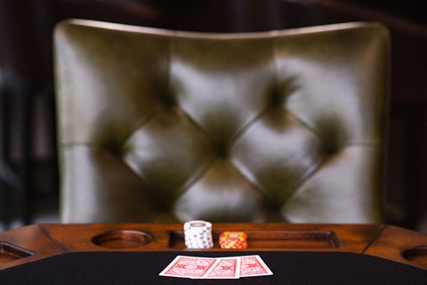 a poker table with cards and dice on it