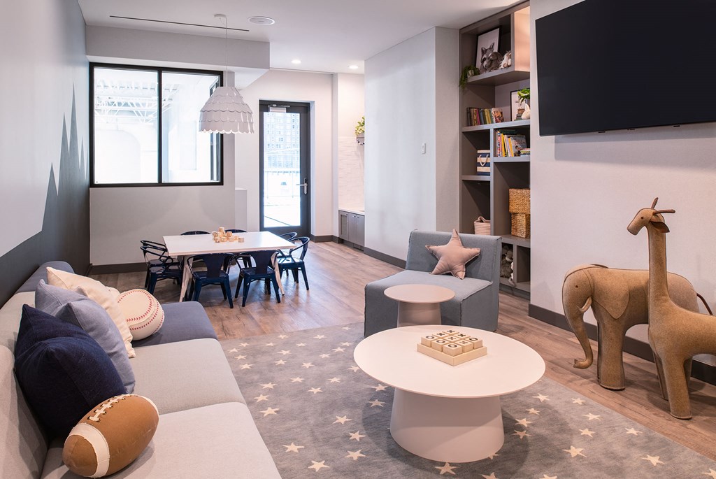a living room with a couch and a table and a tv