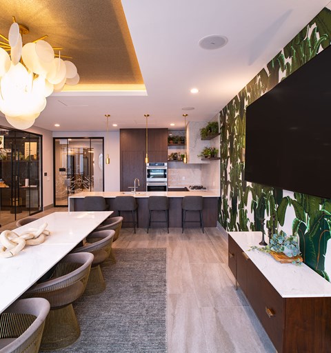 a large kitchen with a dining area and a table with chairs