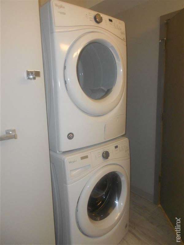 a washing machine and dryer stacked on top of each other