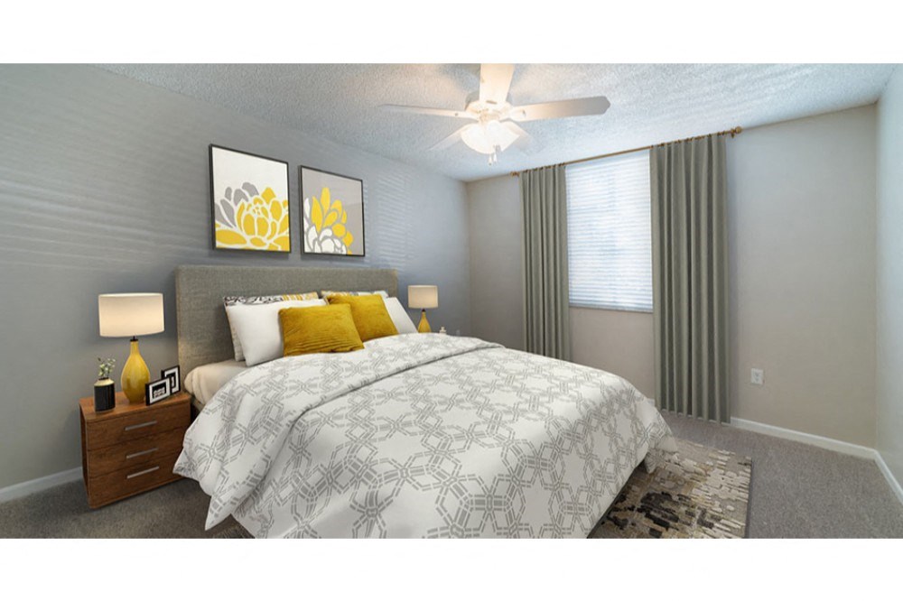 a bedroom with a bed and a ceiling fan