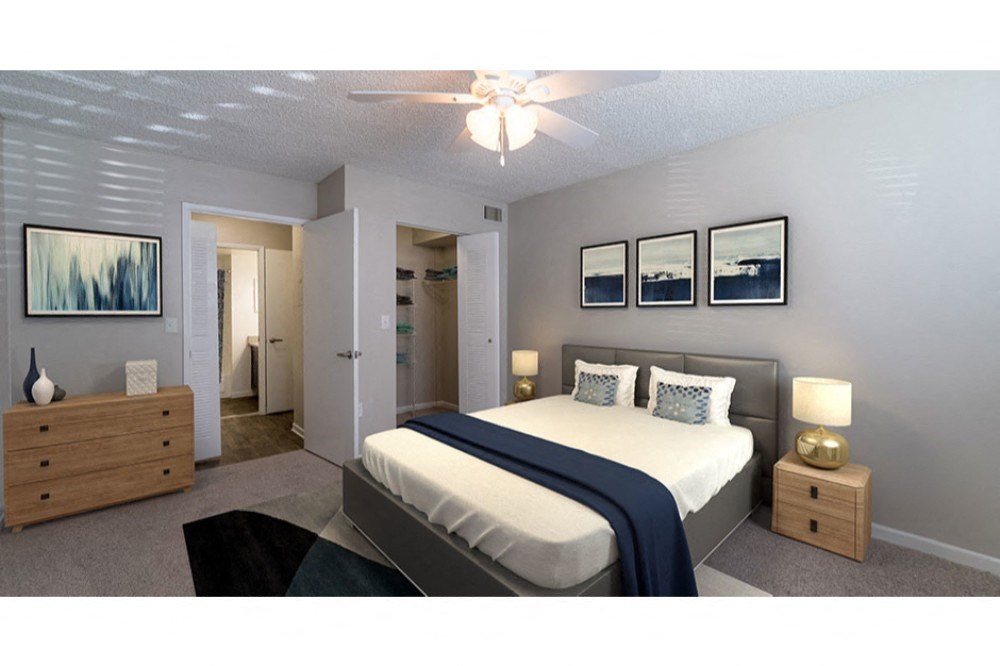 a bedroom with a bed and a ceiling fan