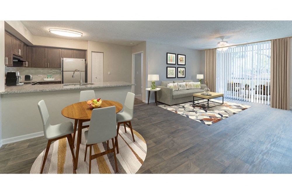 a living room and dining room with a couch and a table