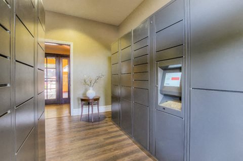 a large walk in closet with stainless steel cabinets