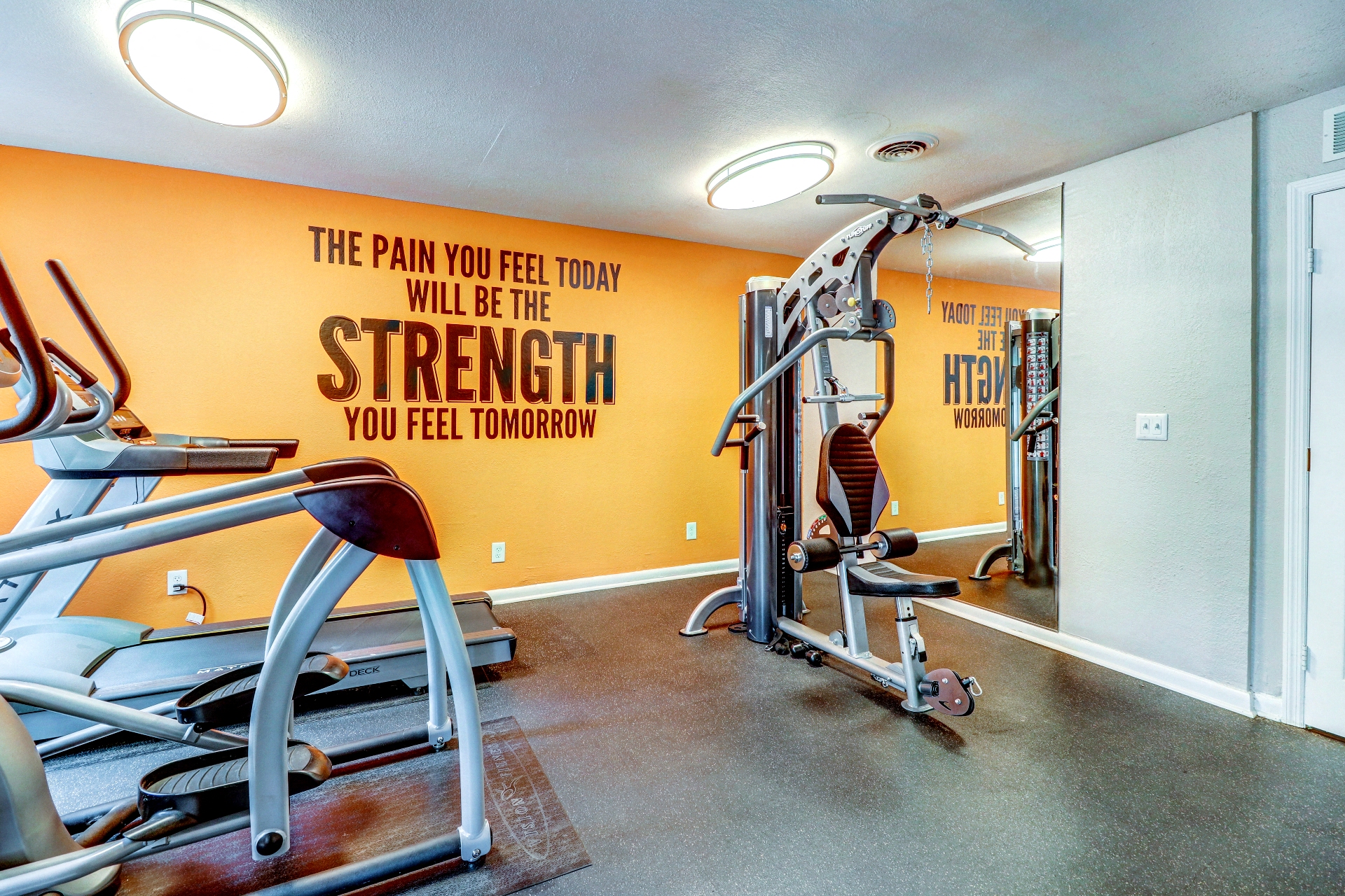 the gym at the district flats apartments in lenexa