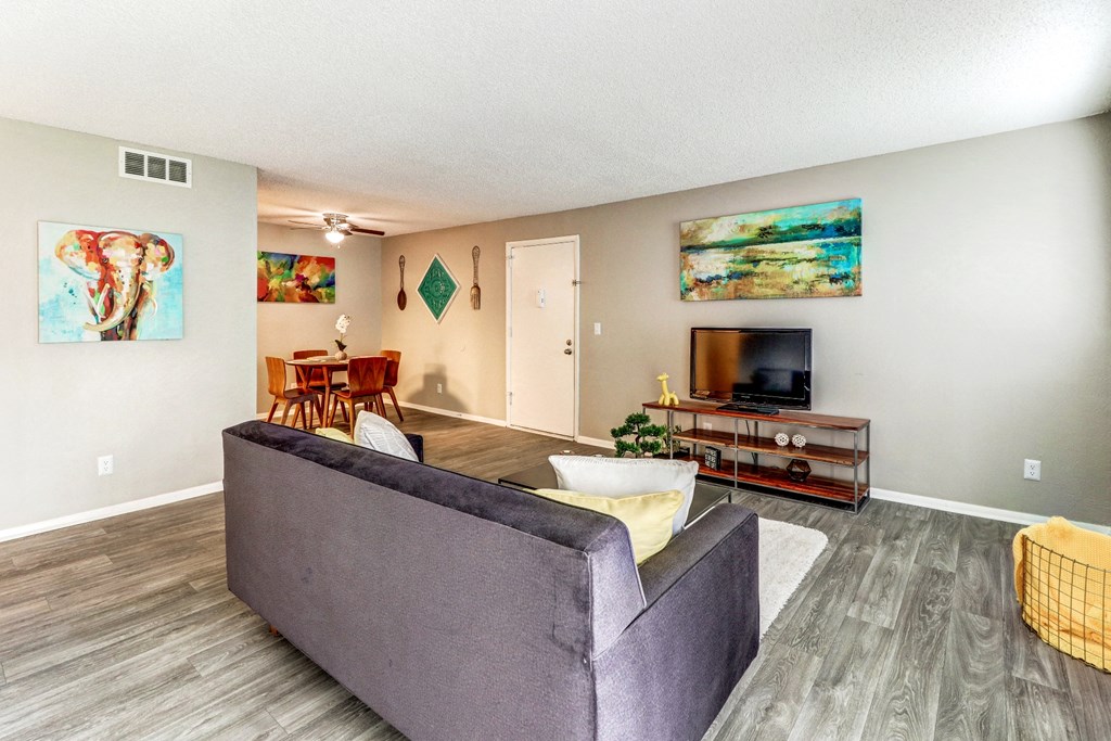 a living room with a couch and a tv