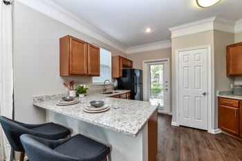 Fitted Kitchen With Island Dining at Artesian on Westheimer, Houston, TX