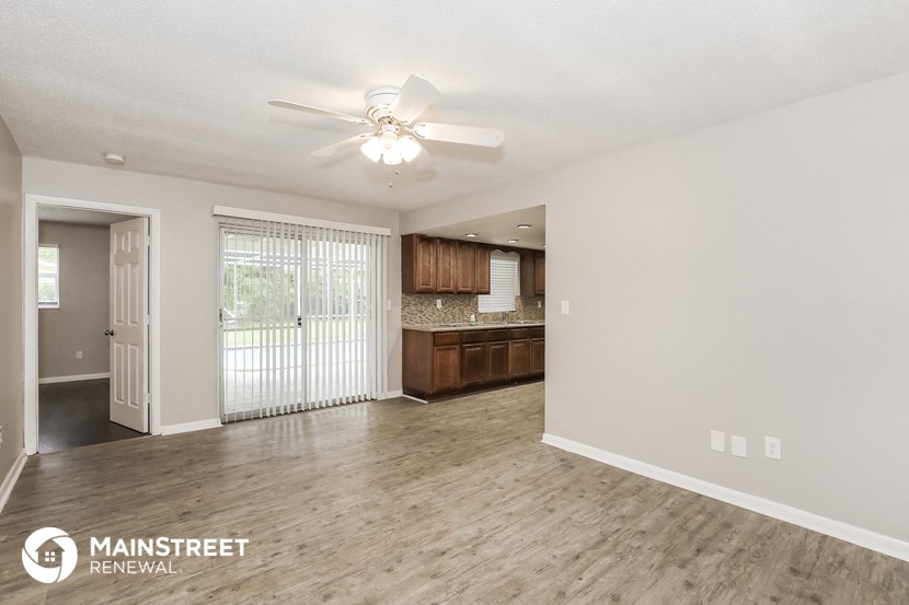 the spacious living room and kitchen of this manufactured home