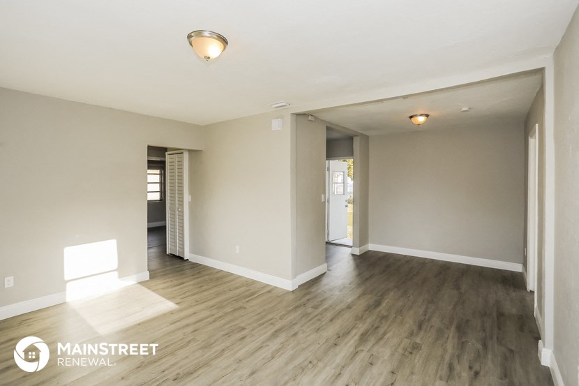 the living room and dining room are spacious and open to the hallway