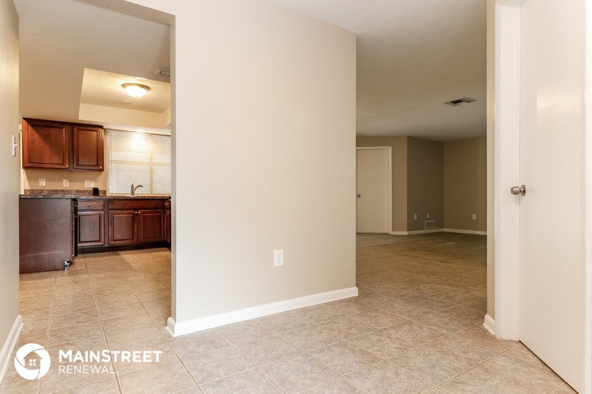 the kitchen and living room are open to the dining room and family room