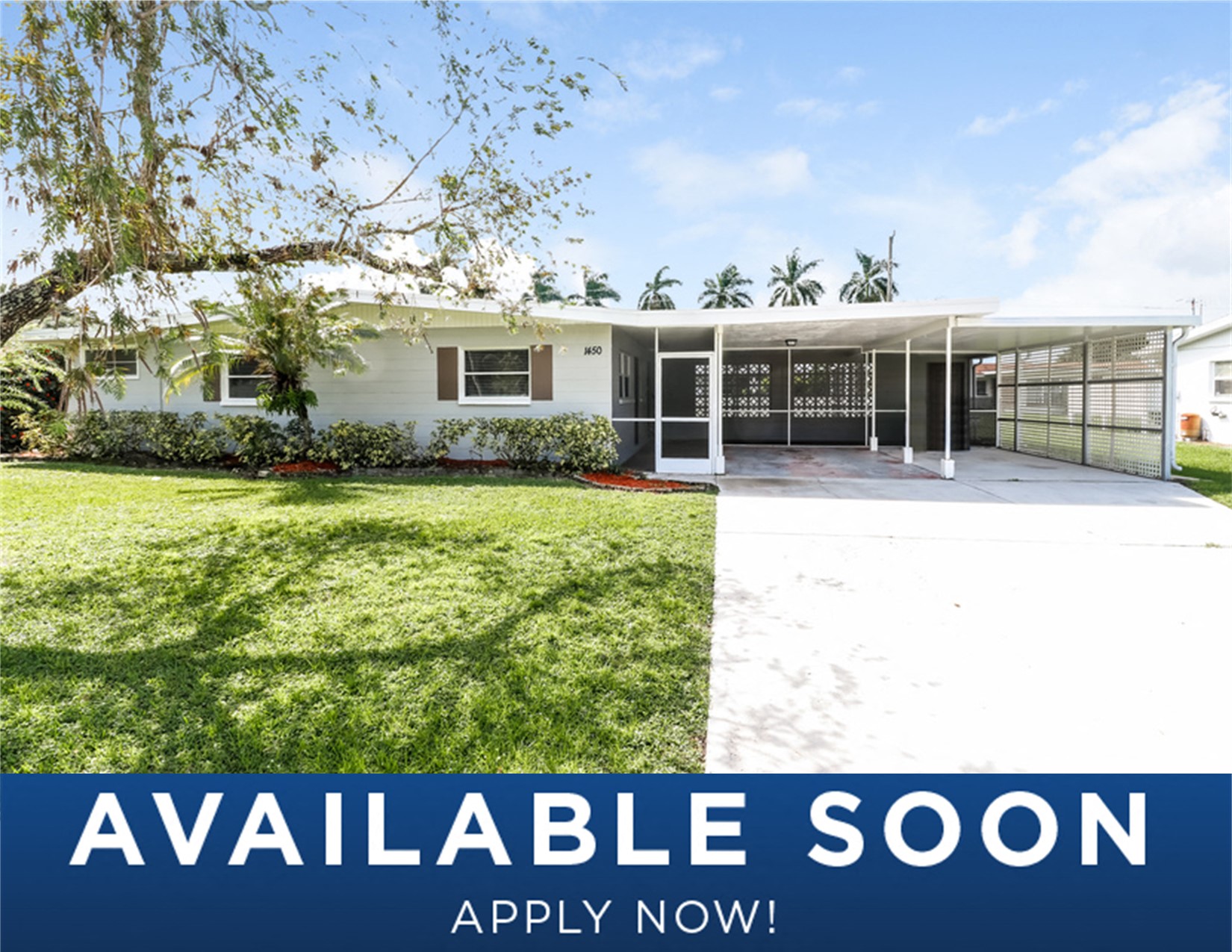 a white house with a lawn and aarpable soon