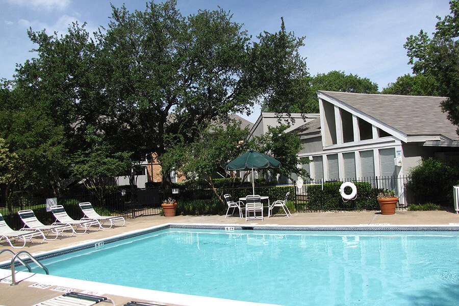 a swimming pool in front of a house