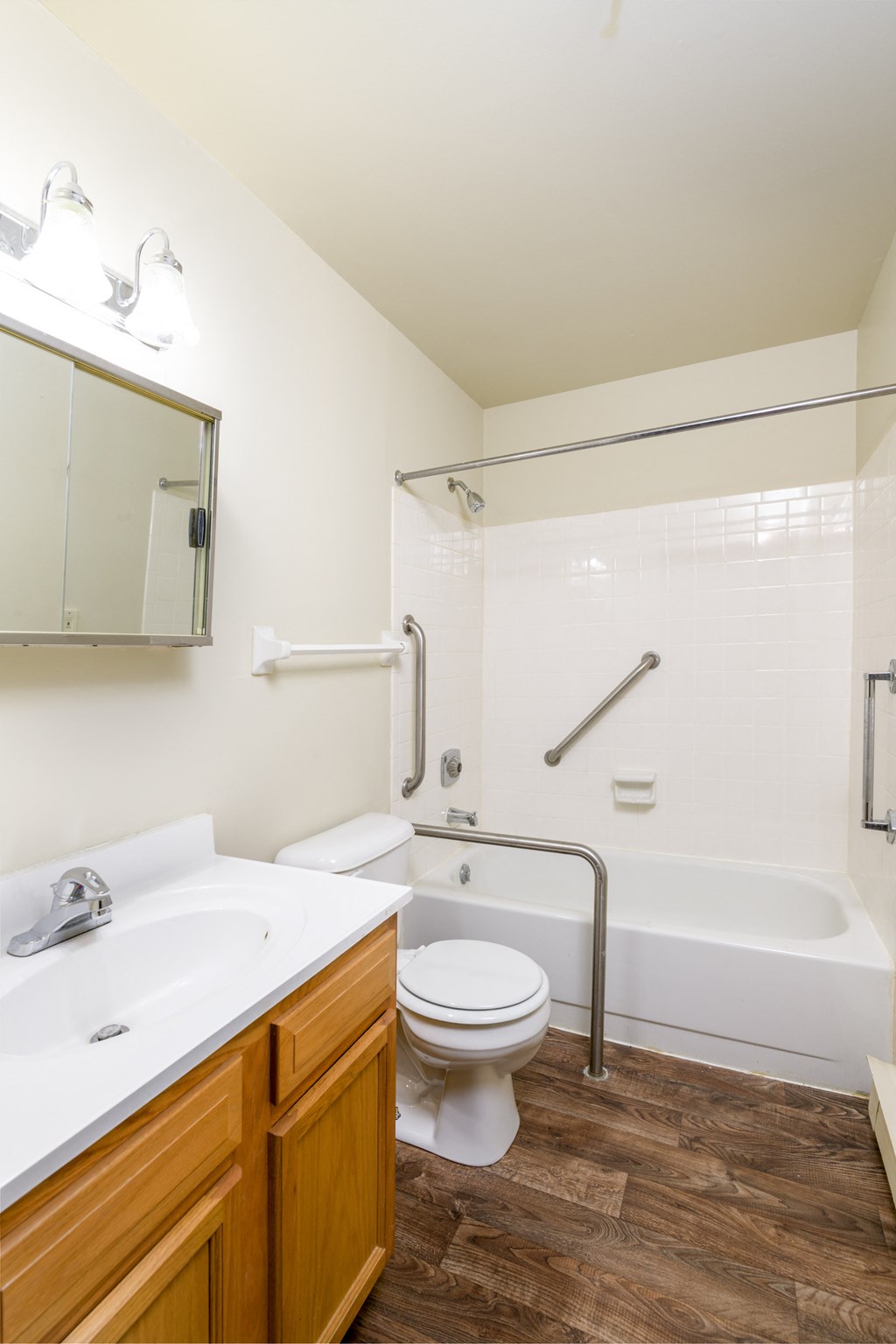 a bathroom with a toilet and a sink and a bath tub