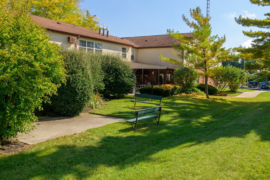 a park bench in front of a building