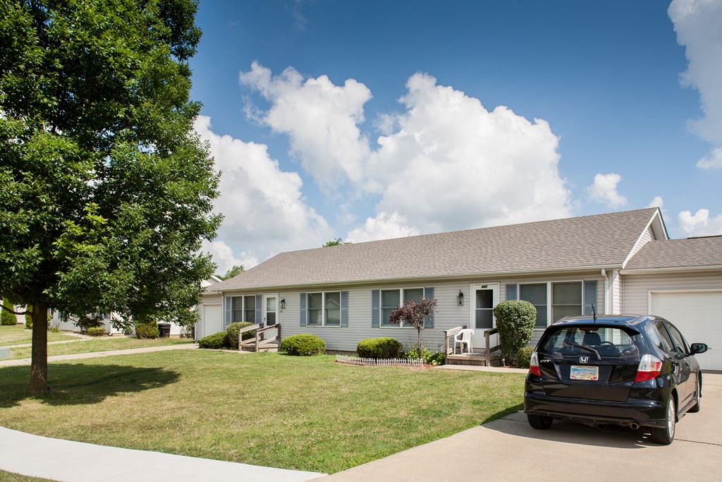 a car parked in front of a house