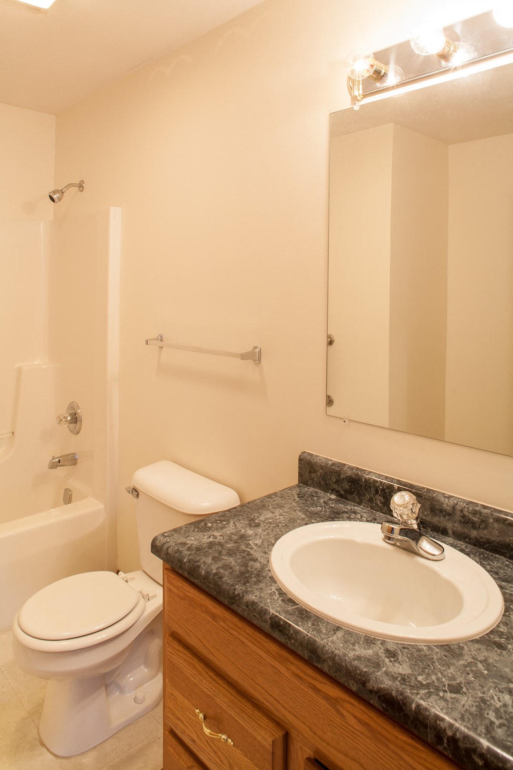 a bathroom with a sink toilet and a mirror