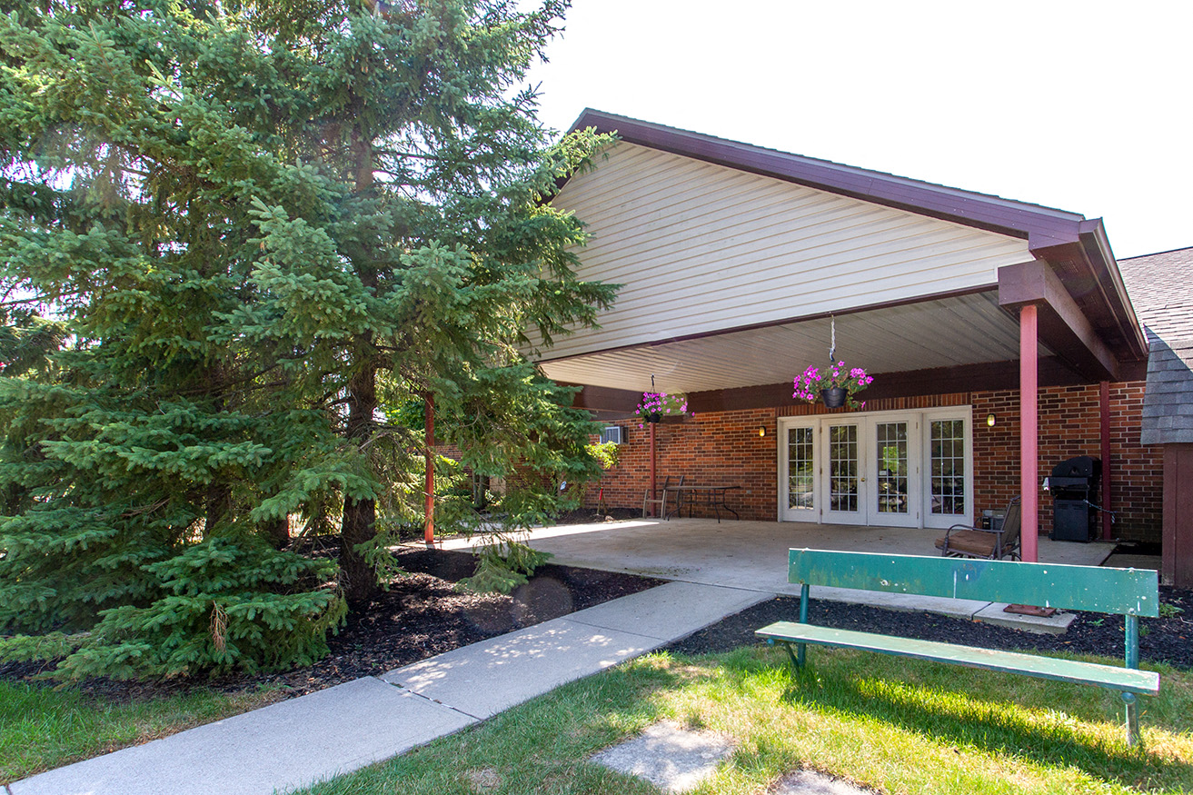 a park bench in front of a building