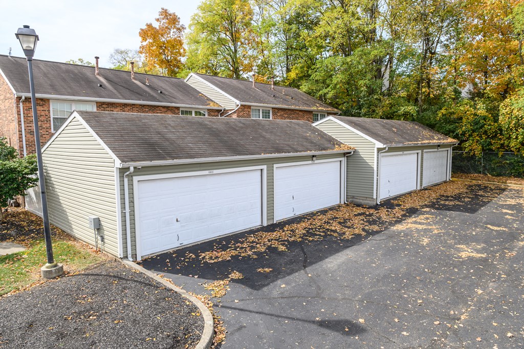a garage with two garages in front of a house