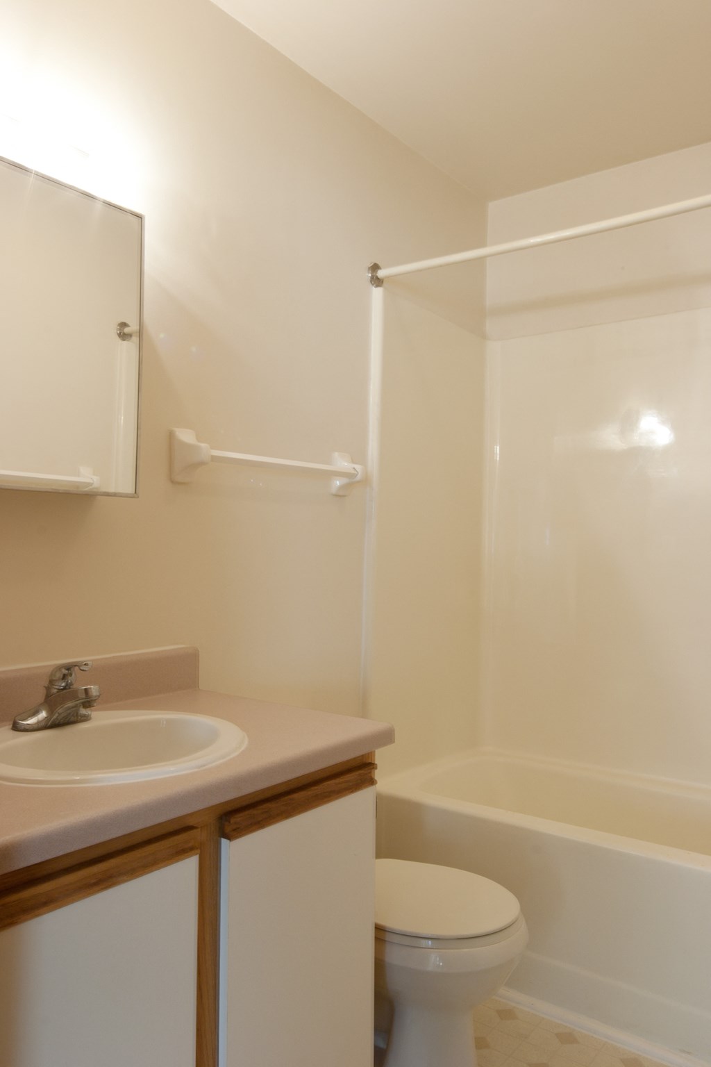 a small bathroom with a sink toilet and shower