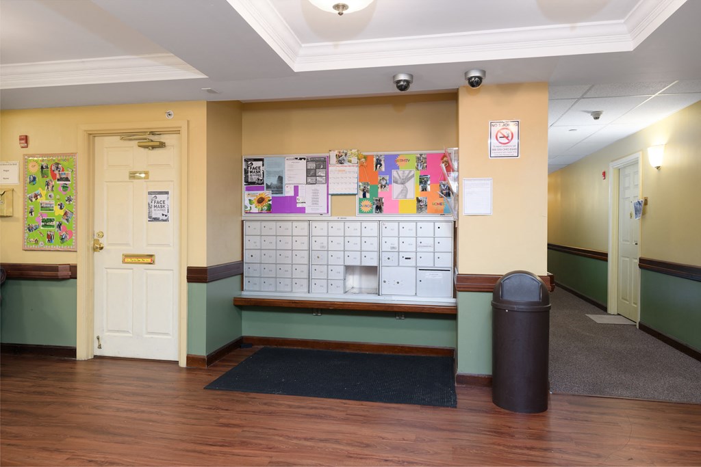 a room with a bulletin board and a calendar on the wall