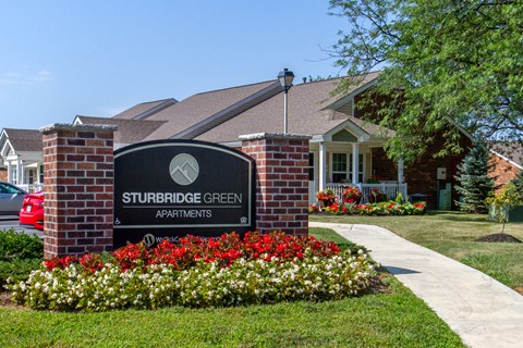 the apartments sign in front of a building