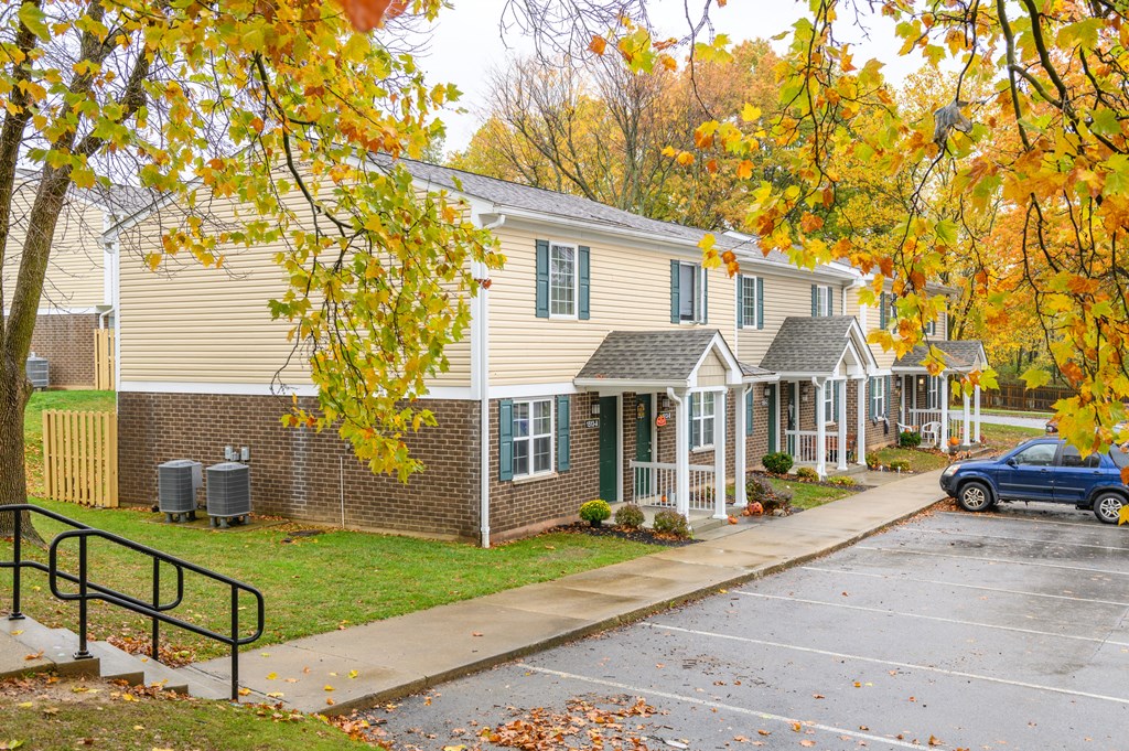 a house with a driveway and a car parked in front of it