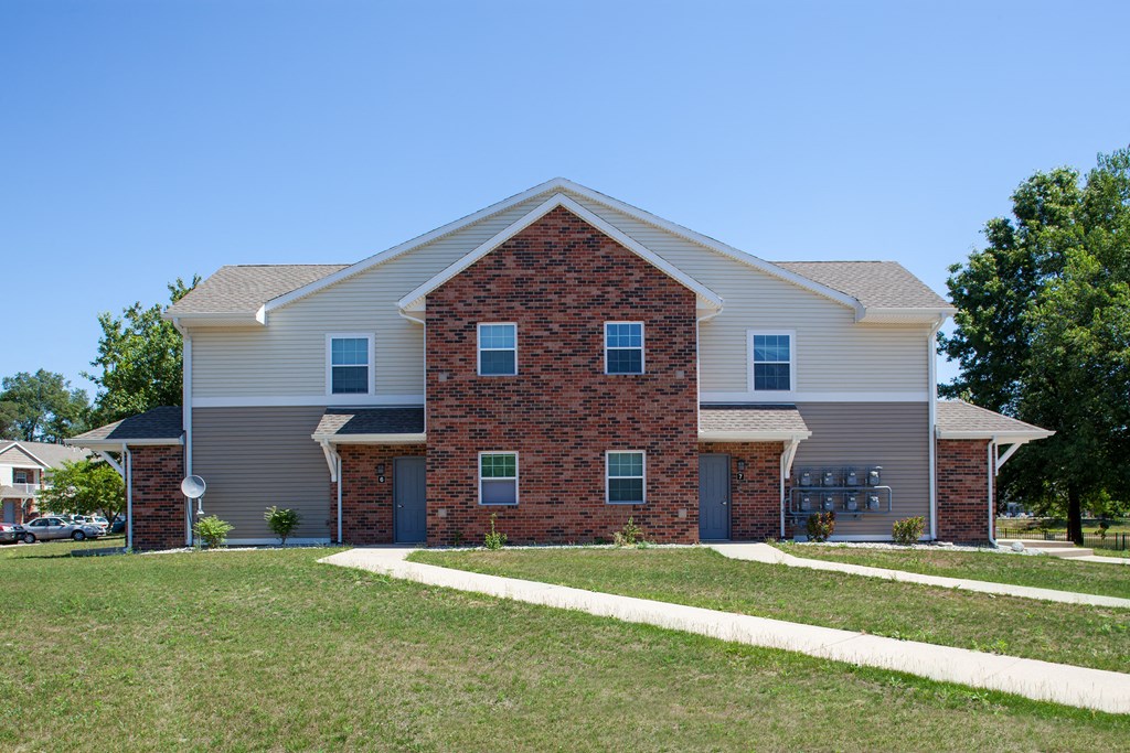 a house with a lawn in front of it