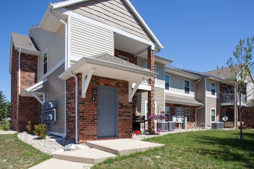 the front of a house with a blue door