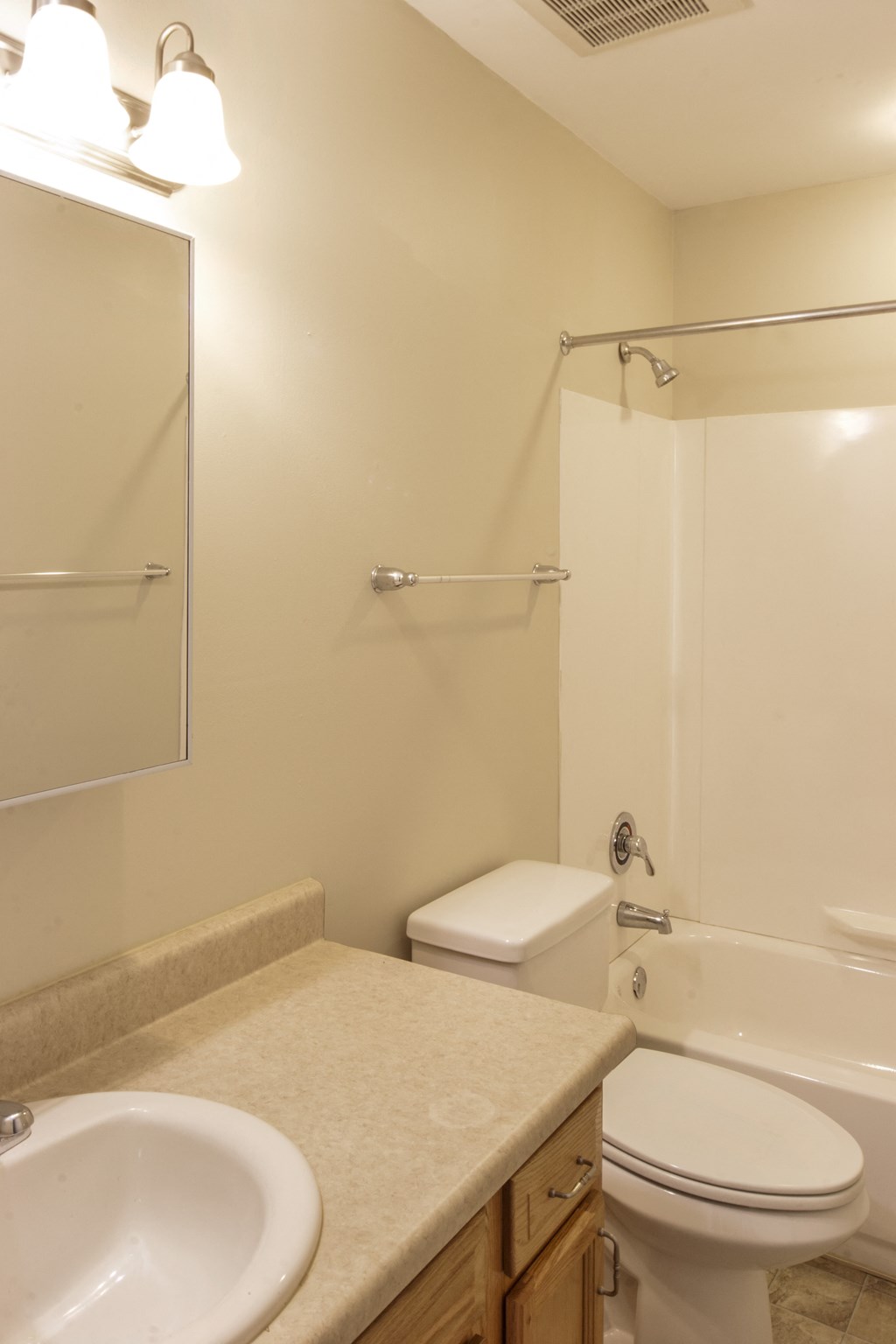 a bathroom with a sink toilet and a shower