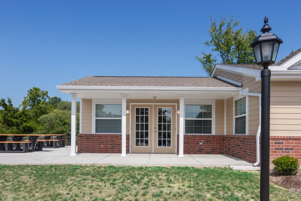 the front of a house with a porch and a street light