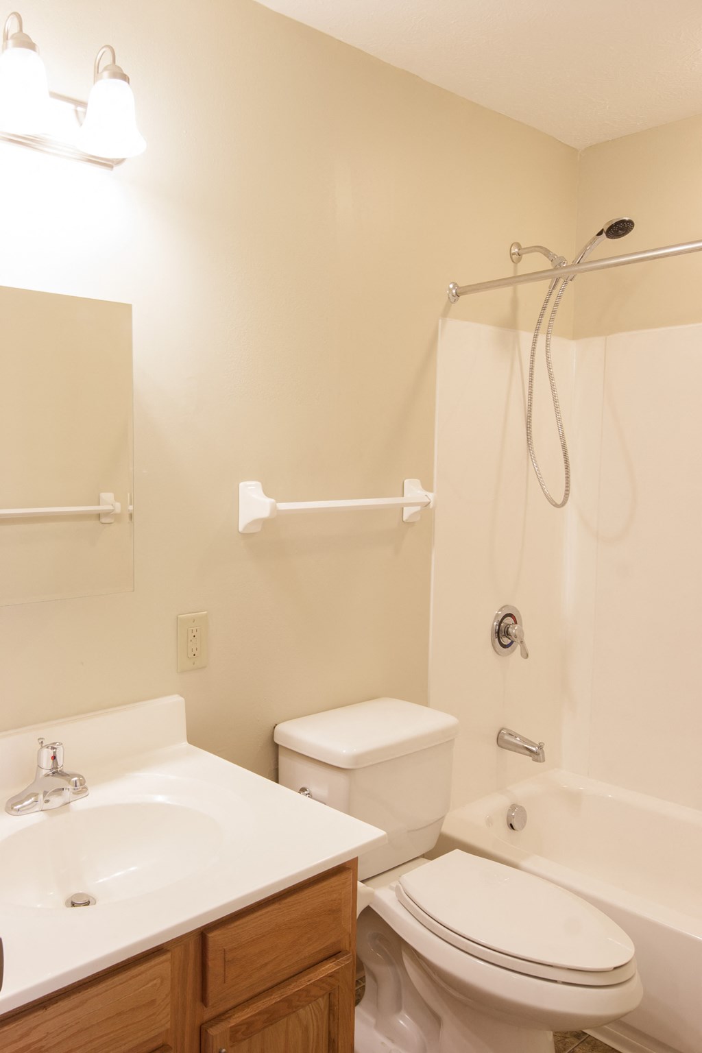 a bathroom with a toilet and a sink and a shower