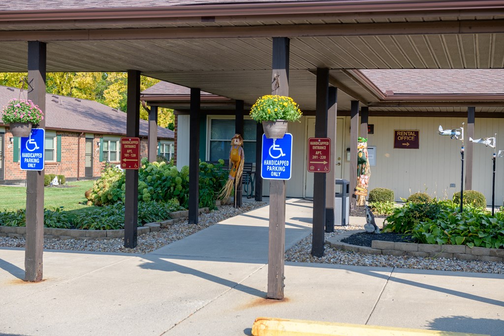 a building with handicapped parking signs in front of it