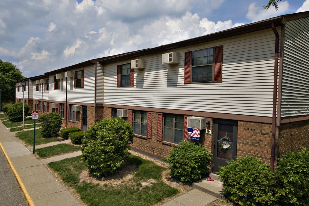an apartment building with a flag in the window